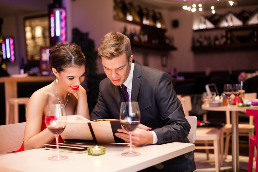 Smiling couple decide what to order